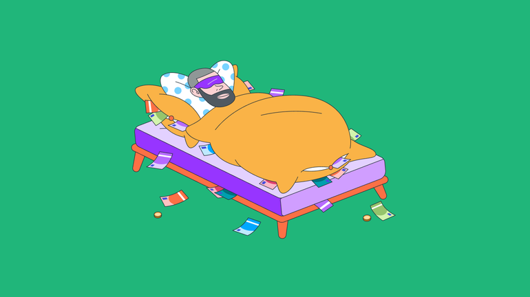 Mann schläft im Bett mit Geld